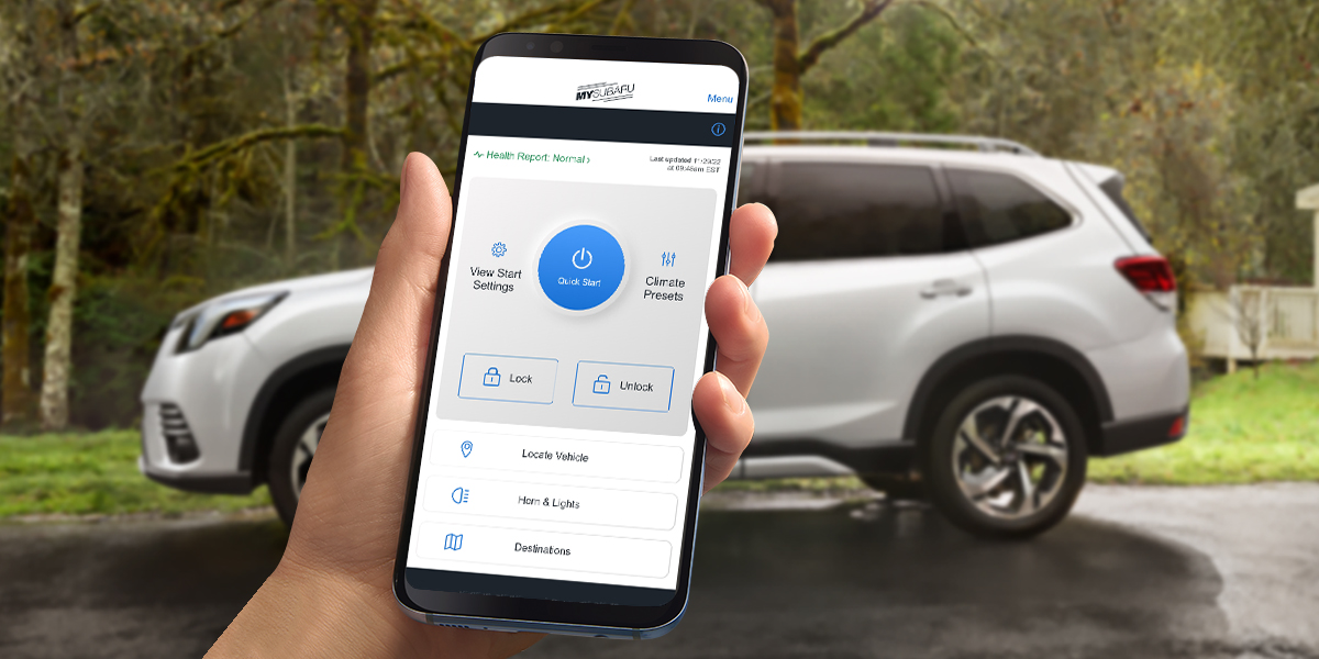 Hand holding phone with MySubaru App